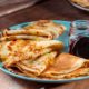 fresh-homemade-french-crepes-made-with-eggs-milk-flour-filled-with-marmalade-vintage-plate_155003-6258