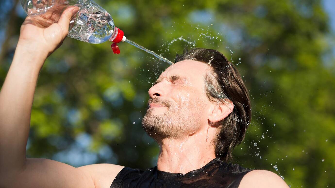 fitness-runner-drinking-splashing-water-his-face-funny-image-handsome-male-refreshing-workout_549566-606