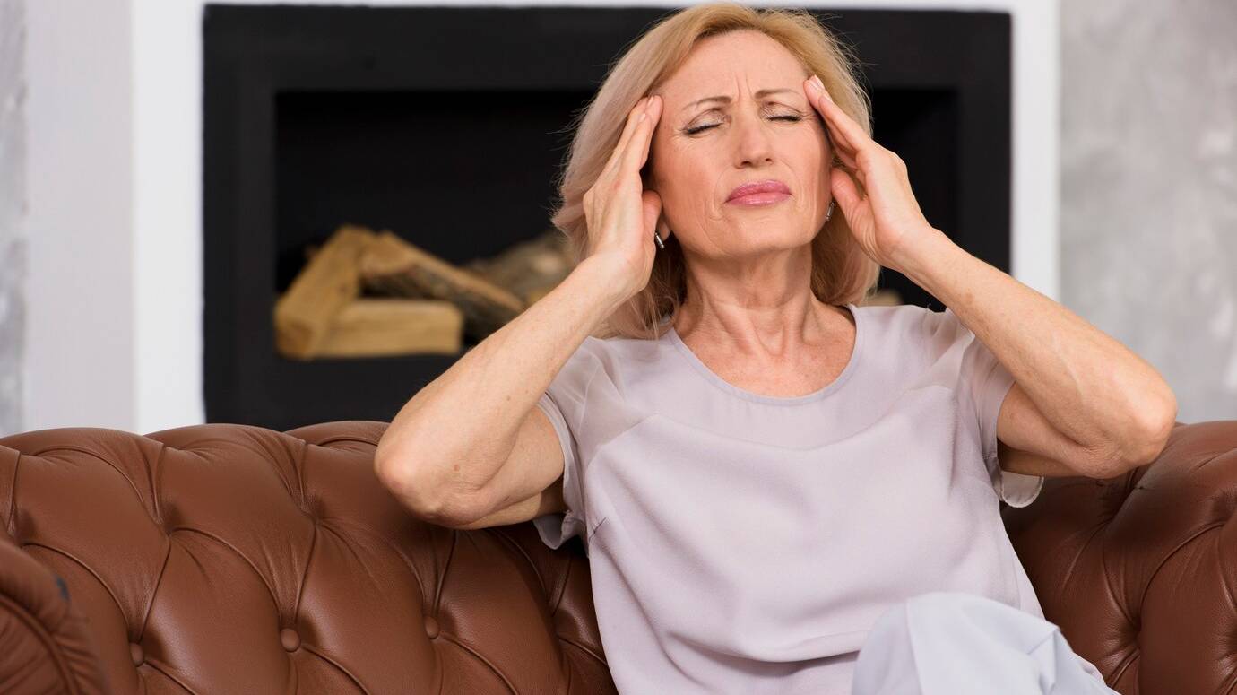 front-view-senior-woman-having-terrible-headache_23-2148286475