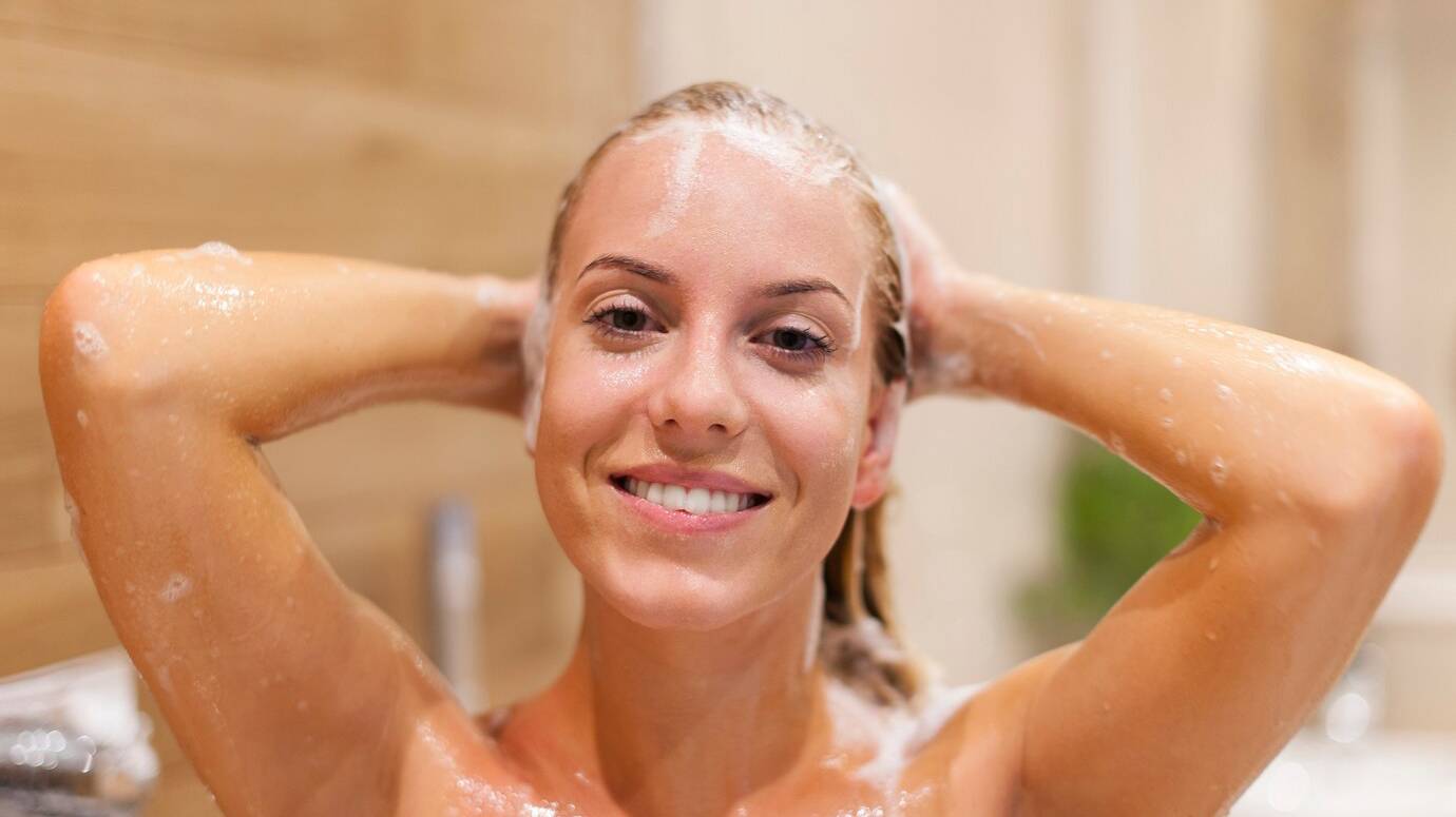 happy-woman-washing-hair-shower_329181-1509