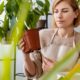 medium-shot-woman-holding-plant-roots_23-2148826076