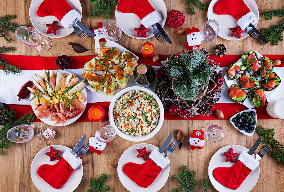 christmas-table-is-served-with-appetizer-decorated-with-bright-tinsel-candles-table-setting-christmas-dinner-flat-lay-top-view_2829-20297