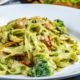 fettuccine-pasta-broccoli-chicken-creamy-sauce-spices-pepper-side-view_141793-3540